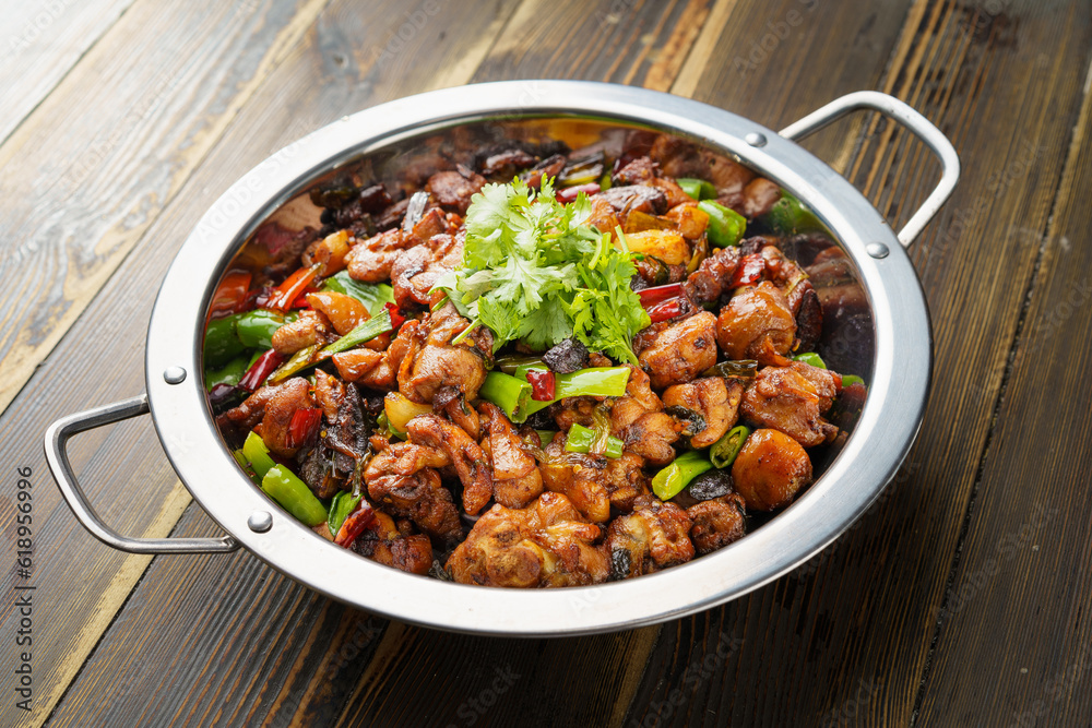 Special Sichuan cuisine griddle chicken on dark background Special Sichuan cuisine griddle chicken on dark background