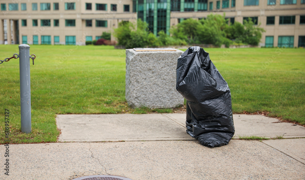 littered streets, discarded cigarette butts, plastic bags, and trash