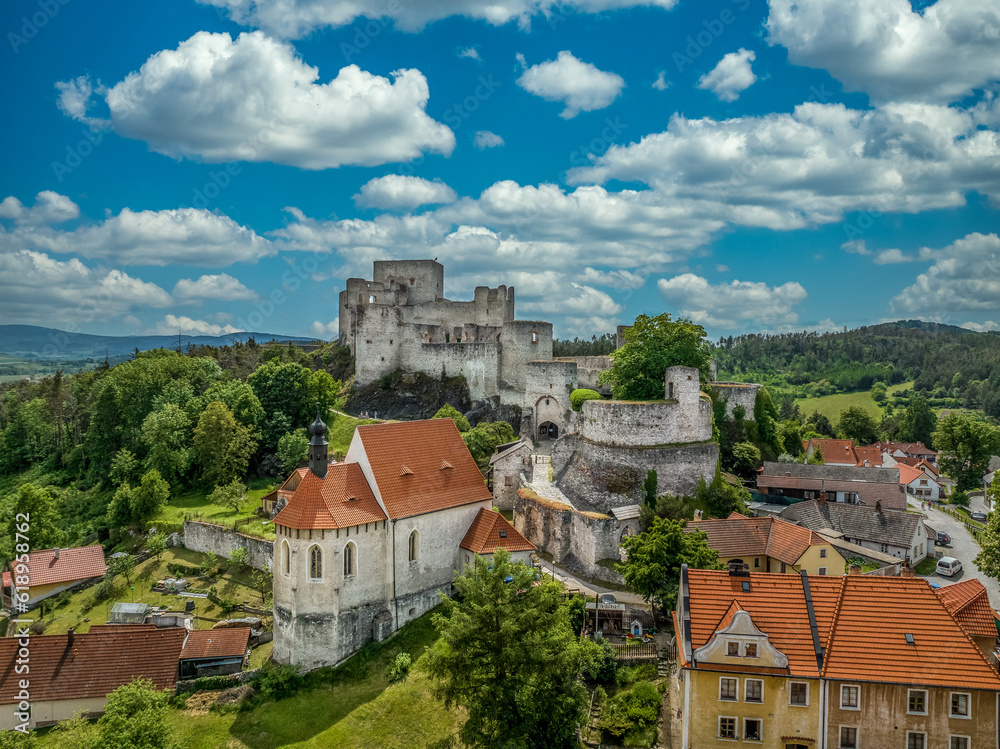 Aerial view of Rabi castle, largest medieval fortress ruin in the Czech Republic with concentric walls and round towers