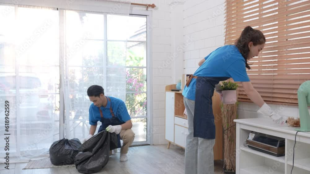 Cleaning service team is cleaning the living room. Cleaning service team is cleaning the living room.