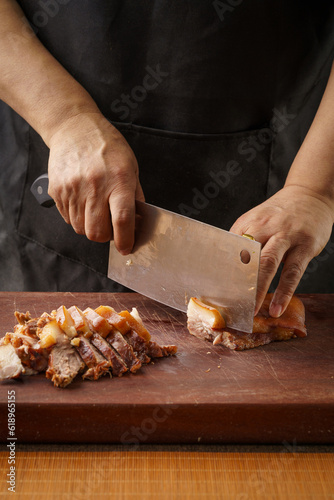 Fresh pork head being sliced