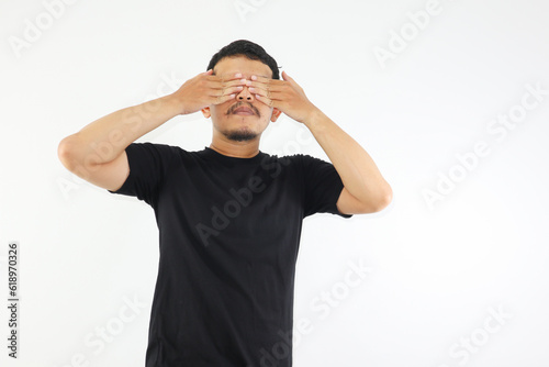 Adult Asian man screaming desperate while close his eyes with hand. mental health concepts. photo