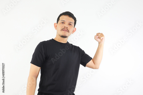 a man clenched his fists and showed a fierce and straight face, isolated on white background photo