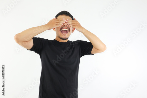 Adult Asian man screaming desperate while close his eyes with hand. mental health concepts. photo