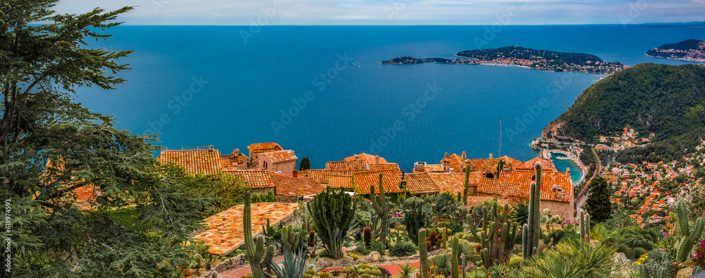 Scenic view of the Mediterranean coastline and medieval houses from the top of the town of Eze village on the French Riviera