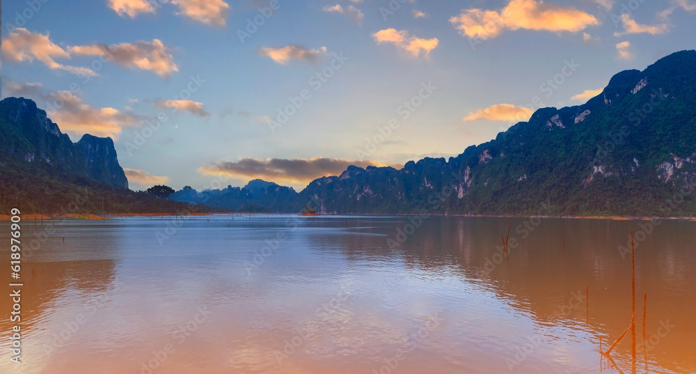 The Aerial  sunset view at Khao Sok national park Cheow Lan Dam lake with blue sky background  in Surat Thani, Thailand