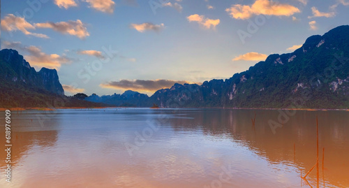 The Aerial sunset view at Khao Sok national park Cheow Lan Dam lake with blue sky background in Surat Thani, Thailand © SASITHORN
