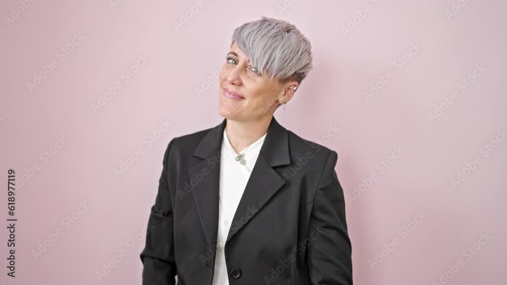 Young woman business worker saying yes with head smiling over isolated pink background Young woman business worker saying yes with head smiling over isolated pink background