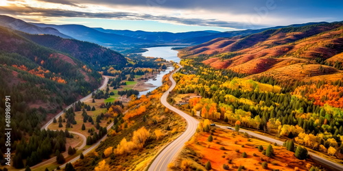 breathtaking aerial view of a picturesque countryside during the autumn season, with trees adorned in vibrant shades of red, orange, and yellow, and winding country roads. Generative AI