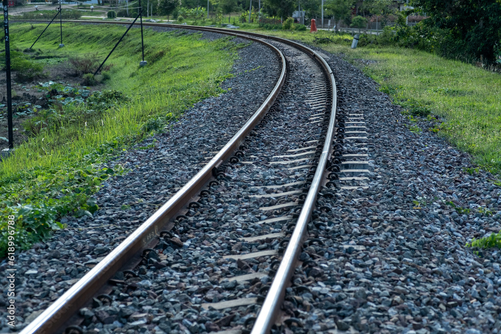 Train tracks in rural scene. Railroad in the park. vintage railroad close up. Train tracks in rural scene. Railroad in the park. vintage railroad close up.