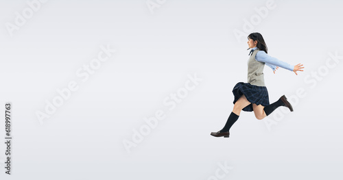 ジャンプする制服の女子学生 （切り抜き背景透過PNGも販売しております。作成者リンクから「PNG」で検索してください）