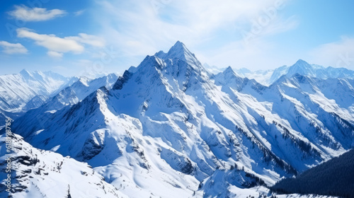 Beautiful winter mountains panorama background with snow covered peaks and clear blue sky