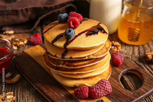 Stack of golden pancakes wi...