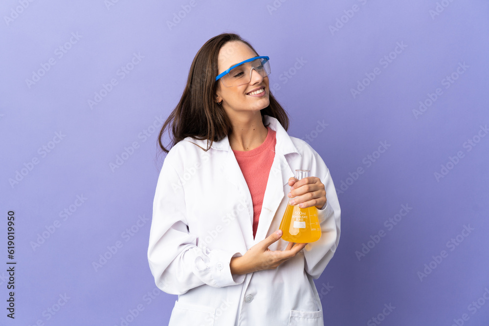 Young scientific woman over isolated background thinking an idea while looking up Young scientific woman over isolated background thinking an idea while looking up