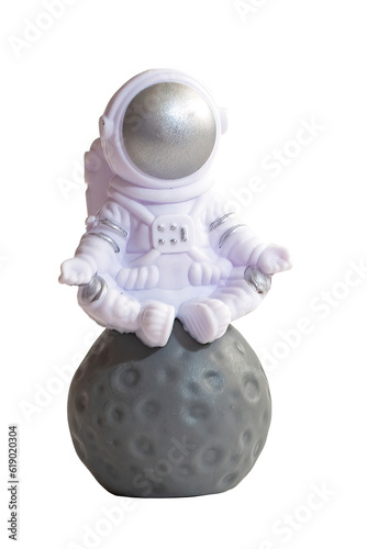 small toy austronaut, isolated on blank background. photo