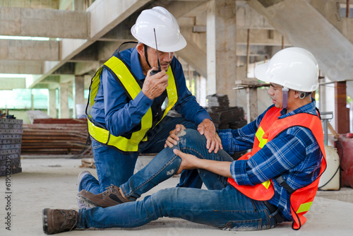 construction workers had an accident patient suffering misfortune physical knee injury from working at site, senior men helping young colleague after dangerous accident, safety and risk concept photo
