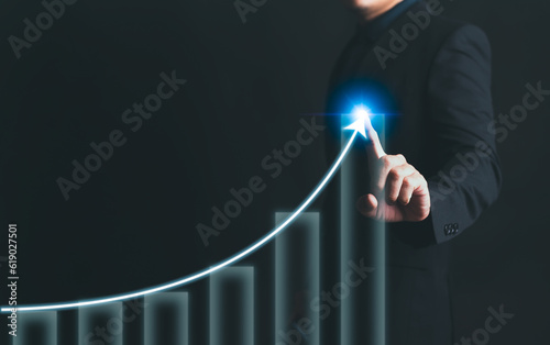 Businessman man hand touching virtual stock market graph chart for technical investment analysis concept