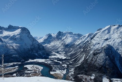 Breathtaking view of a fjord between the snow-covered mountains in Andalsnes, Norway © Karol Ryan Riconalla/Wirestock Creators