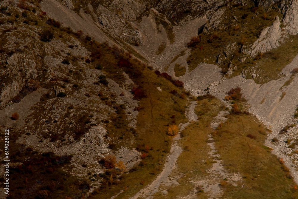 Obraz premium Aerial shot of the rocky big mountains and mountainsides during the autumn season