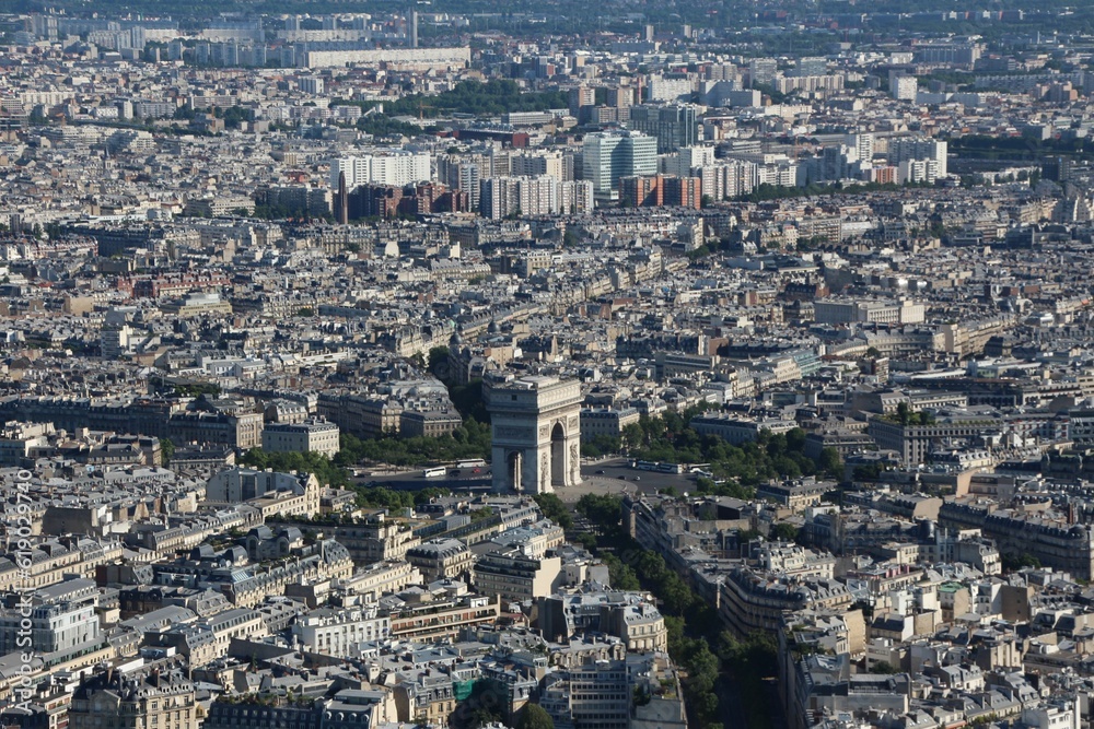 Aerial shot of Paris, France showcasing the stunning cityscape illuminated in the sunlight