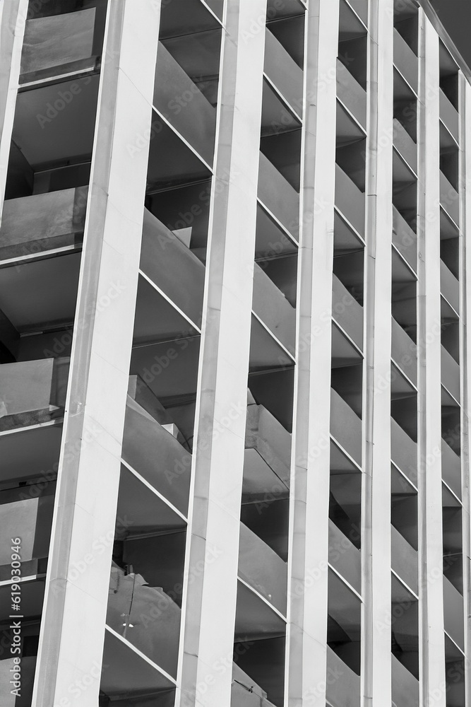 greyscale shot of a facade of a new building