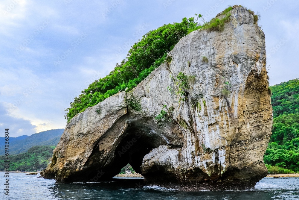 Majestic stone set in the center of a tranquil body of water of Los Arcos in Puerto Vallarta Mexico