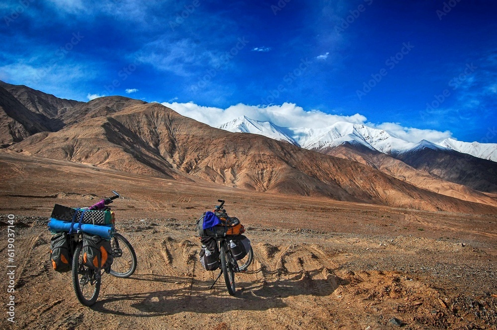 Bicycles with loads against Atlas mountains on a sunny day Bicycles with loads against Atlas mountains on a sunny day
