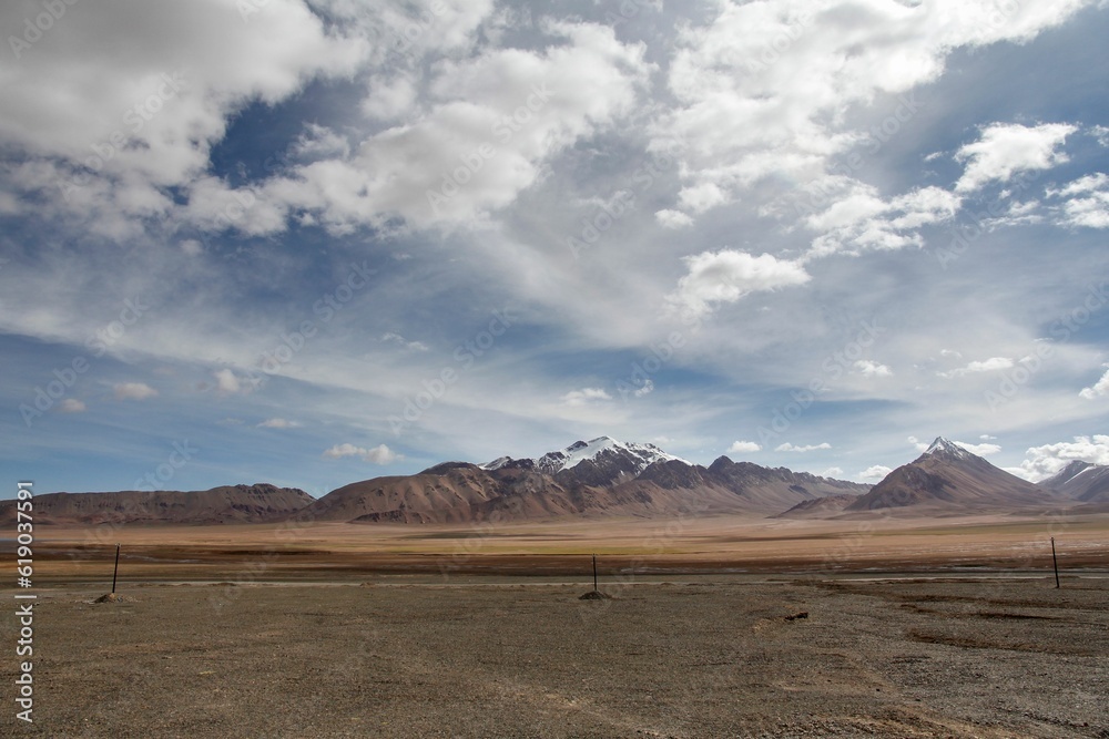 Aerial view of desert surrounded by mountains