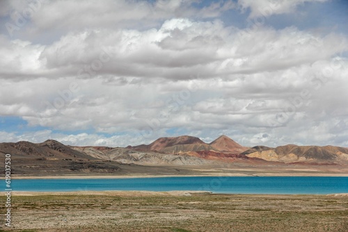 Aerial view of lake in desert surrounded by mountains