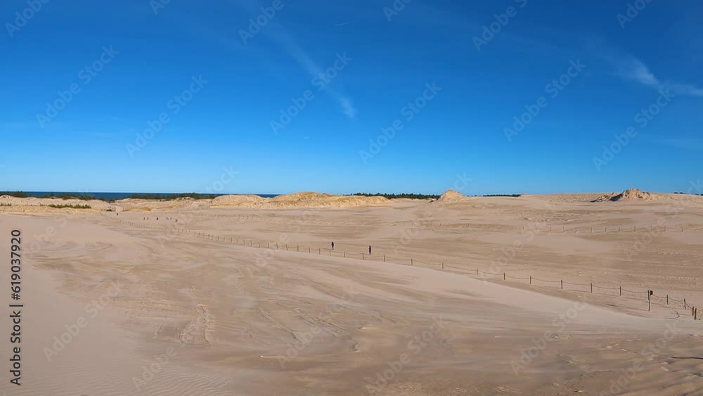 Moving dunes in the desert in Slowinski National Park in Leba, Poland. Time lapse Moving dunes in the desert in Slowinski National Park in Leba, Poland. Time lapse