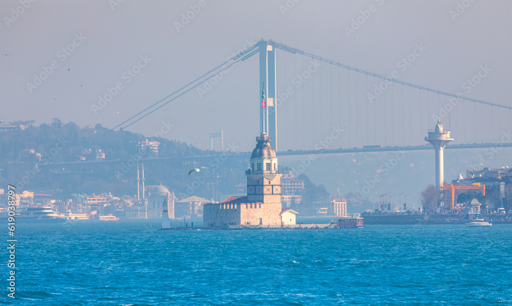 Istanbul Maiden Tower (kiz kulesi) in the background Ortakoy Mosque and Bosphorus bridge - Istanbul, Turkey