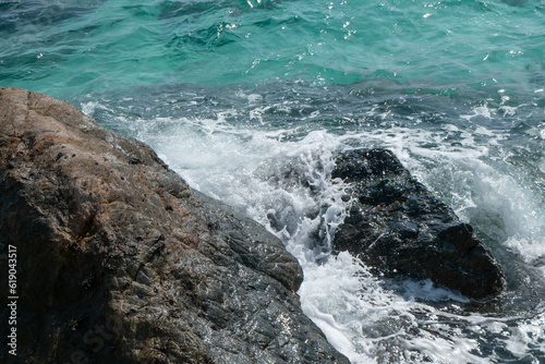 Beautiful scenic seascape blue ocean sea water on rock coast beach with splash wave on island, sky summer stone cliff coastal tide background for travel and tourism, high power turquoise pacific