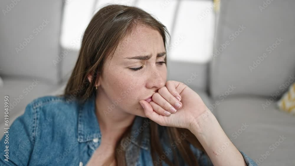 Young beautiful hispanic woman sitting on floor with sad expression at home Young beautiful hispanic woman sitting on floor with sad expression at home