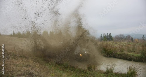 Off-road The SUV drives into a deep puddle.