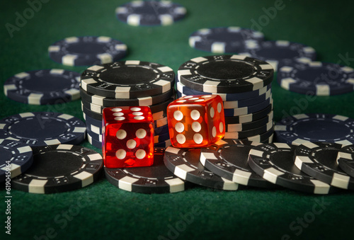 Dice game on the poker table in the casino. A successful combination of two dice brought a lot of winning chips