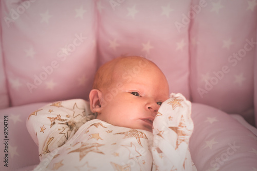 Portrait of adorable baby newborn lying on the bed