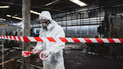 Photos Workers wear protection suit checking chemical contaminated oil in old factory