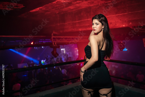 some beautiful girls dancing and posing for a photo at a party. Young people dancing at night club party. selective focus. Long exposition. Moving lights. party concept. Party night club. Nightclub.