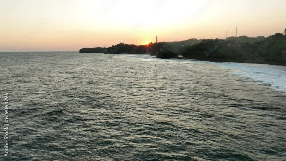 Aerial View of Coastal Cliff and Sea at Sunset Aerial View of Coastal Cliff and Sea at Sunset