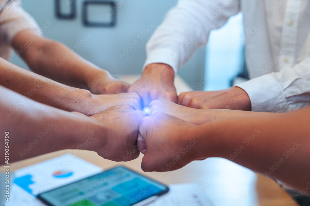 group of employees hand in hand to show power and the best teamwork collaboration Working together in the meeting room.Membership togetherness partnership and success Concept