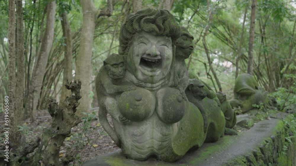 Ubud Monkey Forest Atmosphere - River, Sculptures, Bridge, Trees, Green vegetations Ubud Monkey Forest Atmosphere - River, Sculptures, Bridge, Trees, Green vegetations