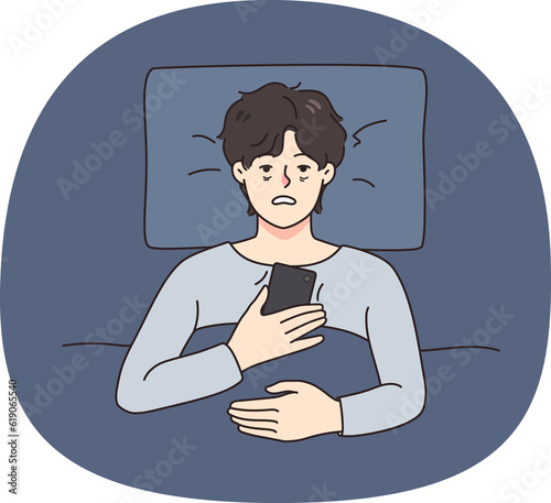 Tired man lying in bed suffer from insomnia