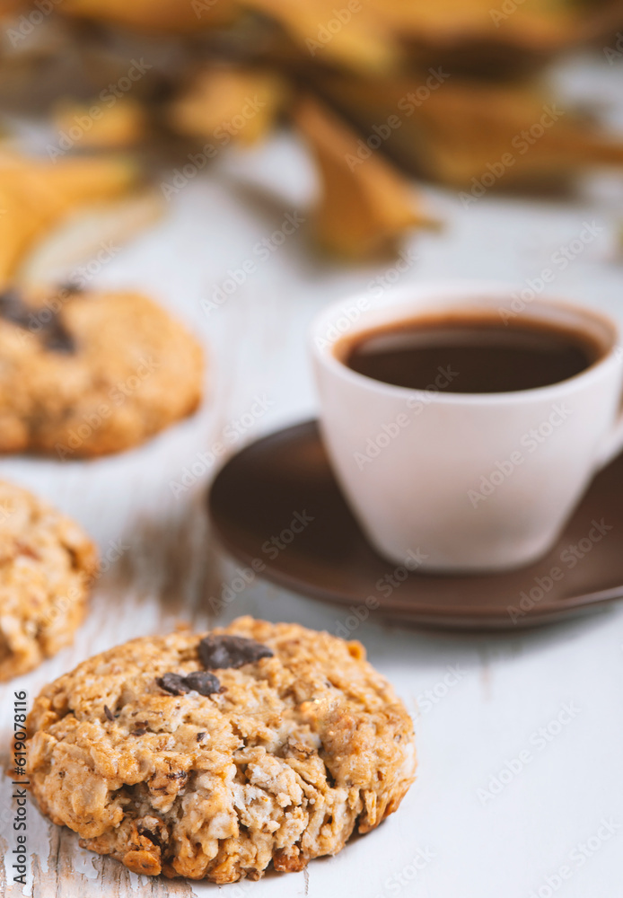 Coffee served with chocolate biscuits , autumn composition