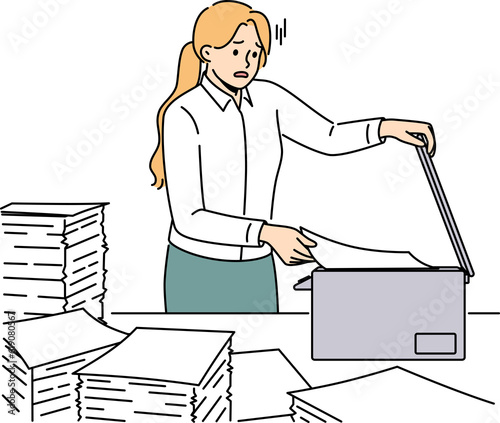 Stressed female employee duplicate paperwork in copy machine photo