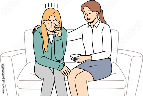 Quadro su tela Crying woman at reception of psychologist consoling patient sitting on couch and