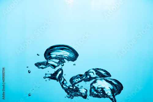 Big air bubble are rising in the blue water , air bubble isolated on blue background.