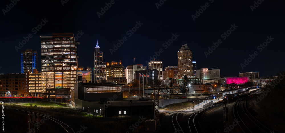 Raligh Skyline At Night with Railroad trakcs on both sides