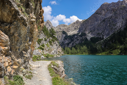 Fototapeta Naklejka Na Ścianę i Meble -  Picturesque View of Tranquil Alpine Lake in Austria. Beautiful Mountain Scene of Tappenkarsee during Summer Travel Day.