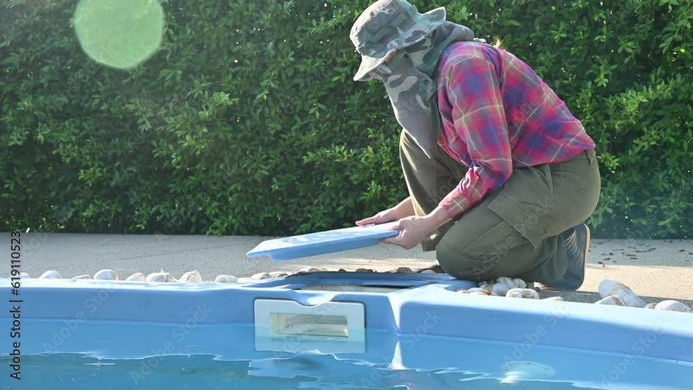 Technician put chlorine tablets in swimming pool. Chlorine tablets used