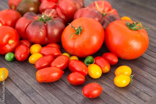 different varieties of ripe red and yellow appetizing tomatoes